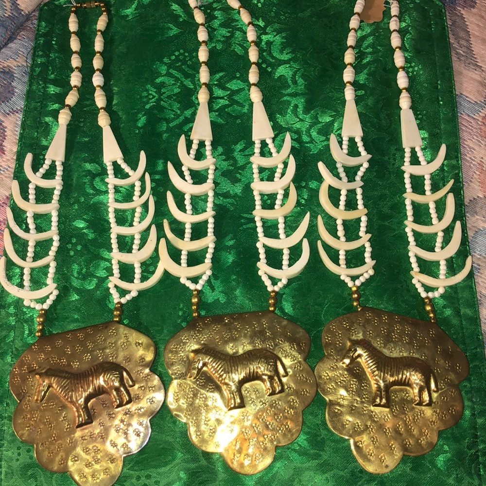 Necklace is made of bone and brass